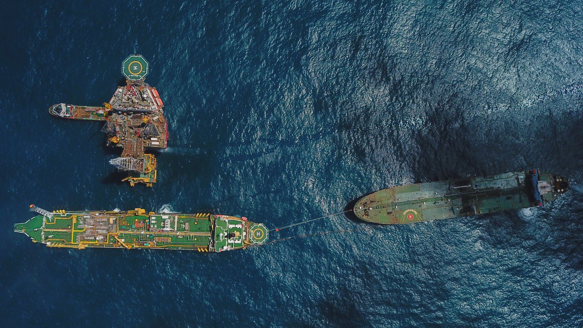 Aerial view of an FPSO offloading to a shuttle tanker