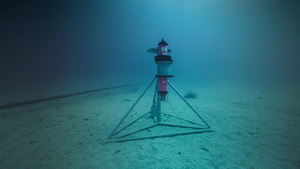 Exail LBL transponder on a tripod frame on the seabed