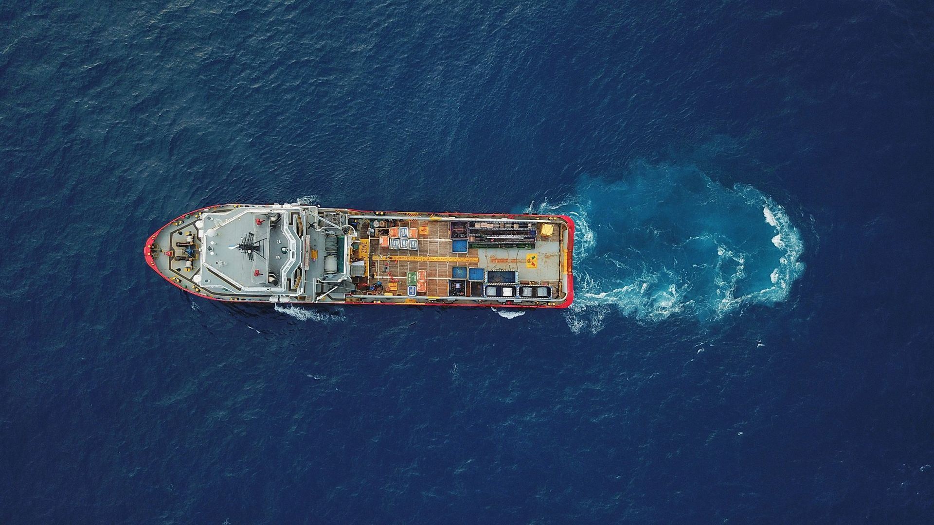 Aerial view of an offshore support vessel under way