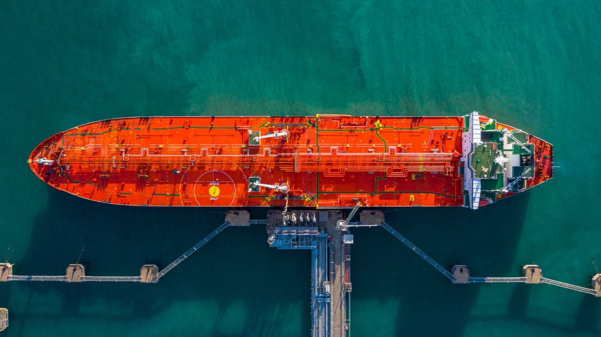 Aerial view of a tanker alongside a loading jetty